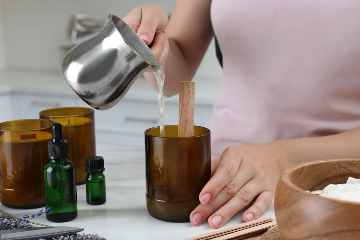 pouring wax into candle at home